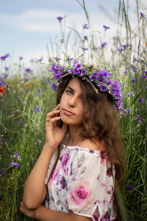 Girl with a Flower Crown Posing with Her Hand on Her Cheek