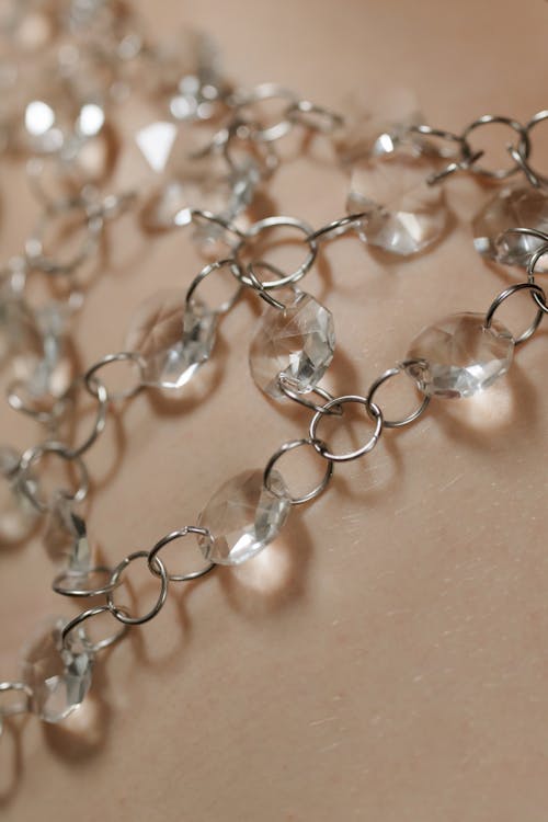 Close-Up Photo of a Silver Necklace with Diamonds