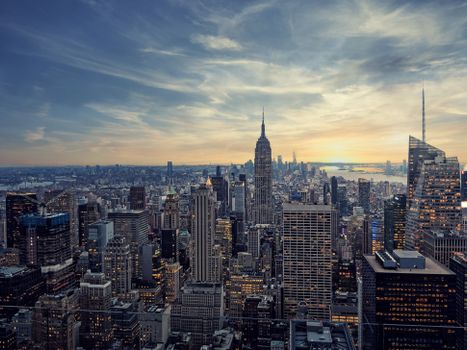 Captivating view of New York City's skyline featuring the iconic Empire State Building at sunset.