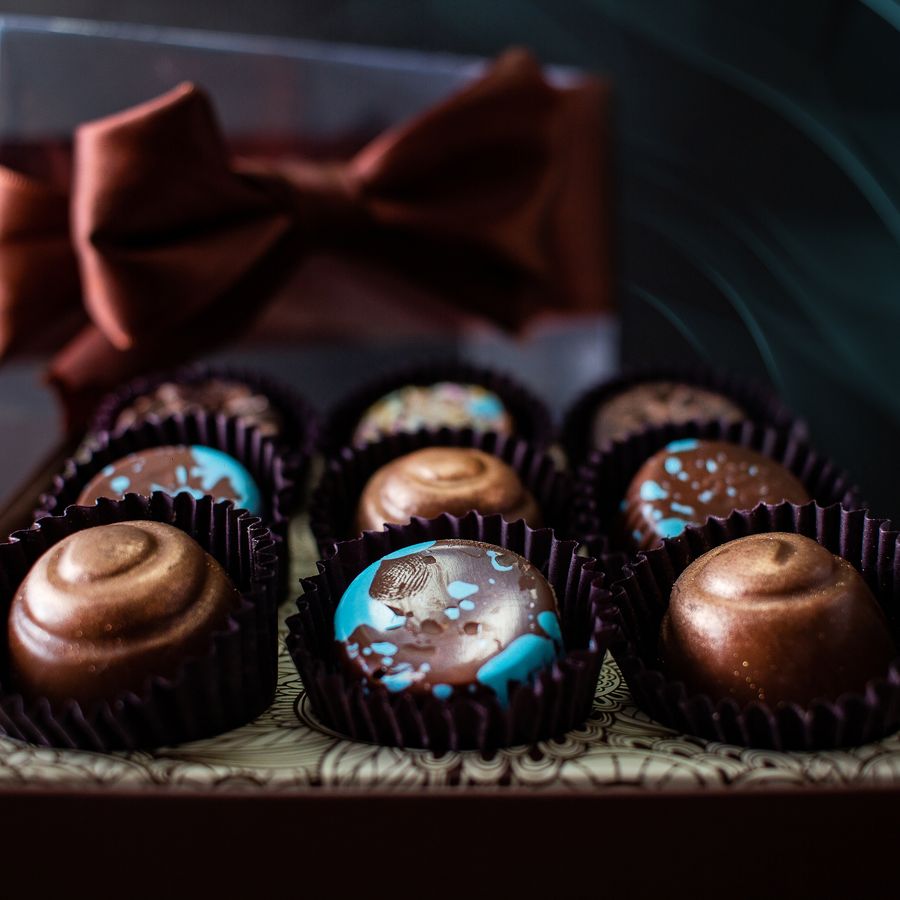 A box of glossy artisanal chocolates