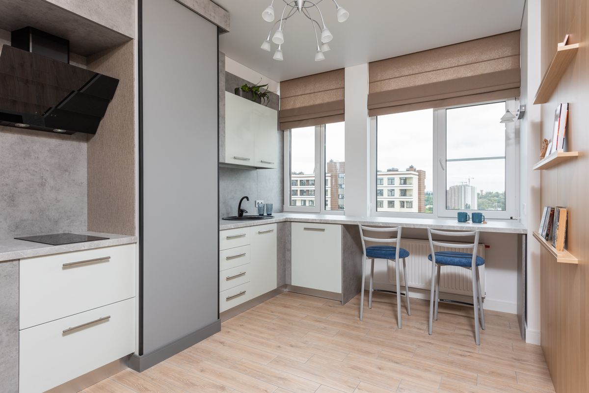 Bright modern kitchen with cabinets and counter seating
