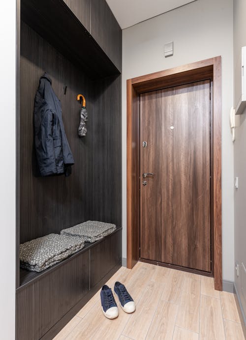 Interior of hallway with hangers near door