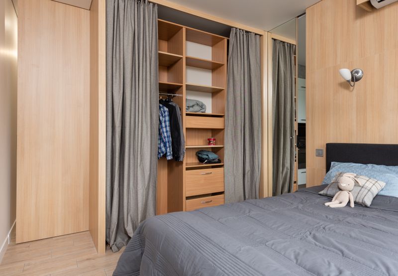 Modern room interior with wooden wardrobe and shelves
