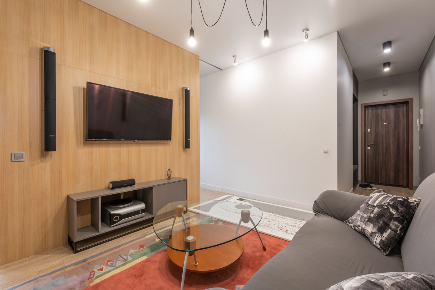 Modern living room with TV wall and furniture