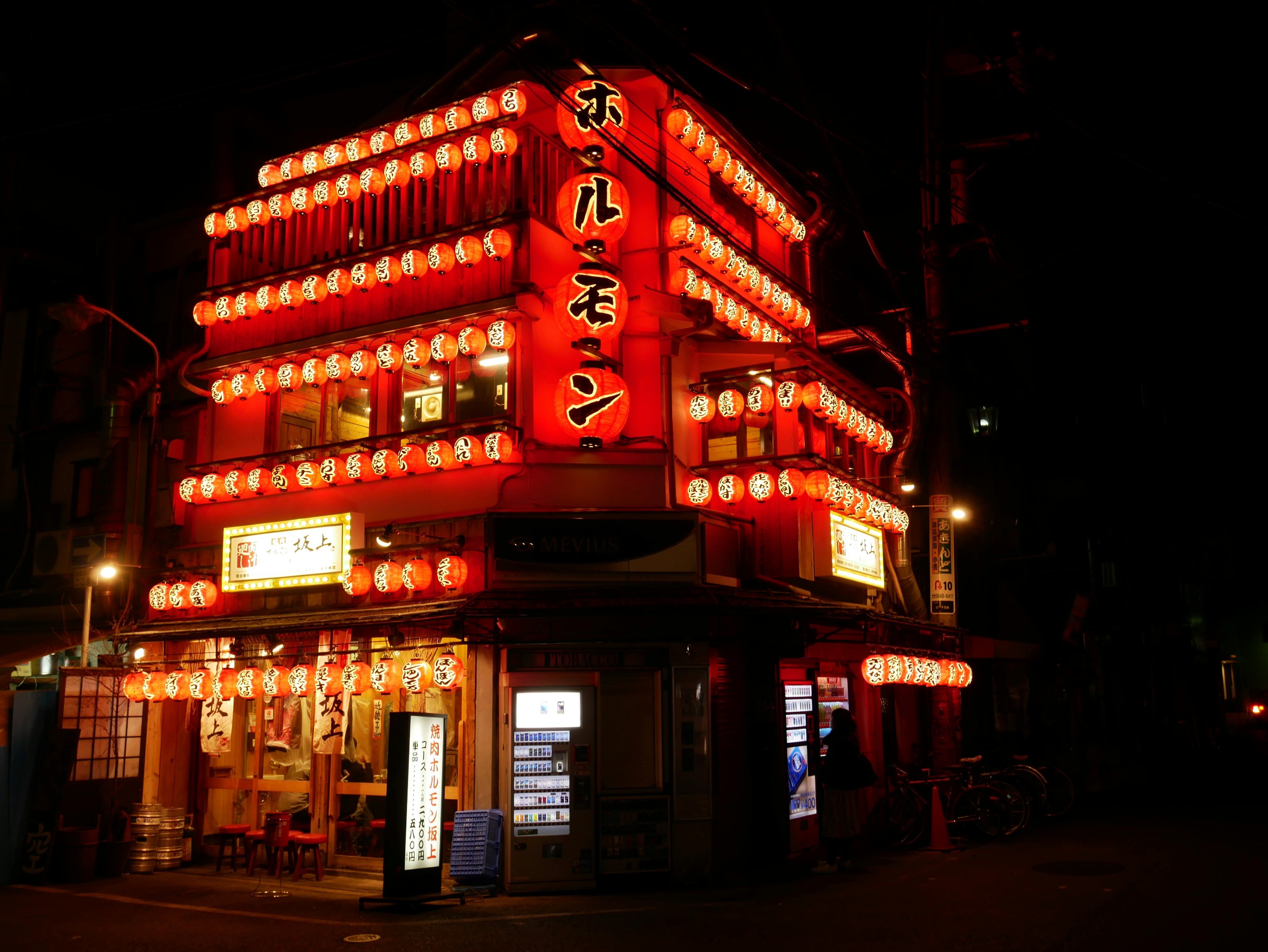 red and white concrete building during nighttime