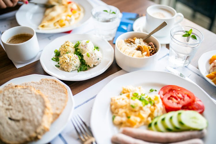 Delicious Breakfast Of Steamed Cutlets And Omelet In Restaurant