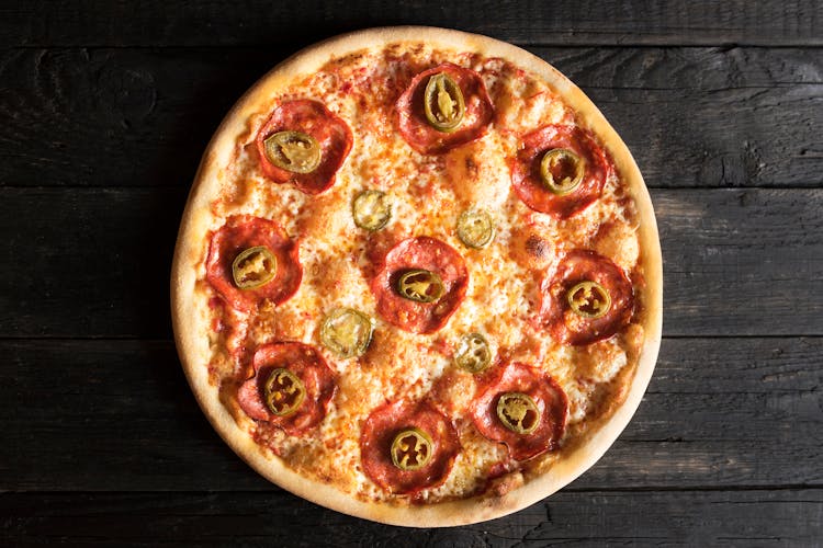 Yummy Pizza With Pepperoni Slices On Dark Background