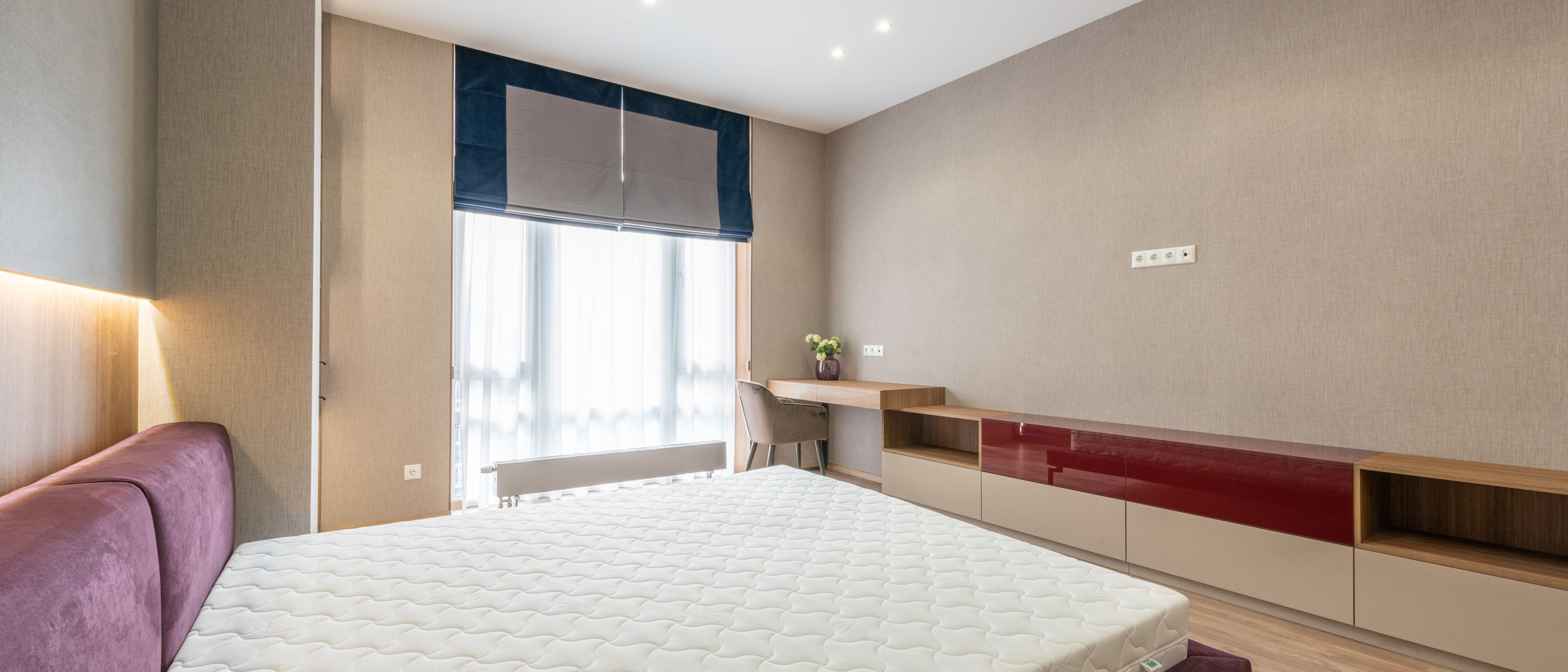 Wallpapering in Harlesden — dust sheets down and the room fully protected