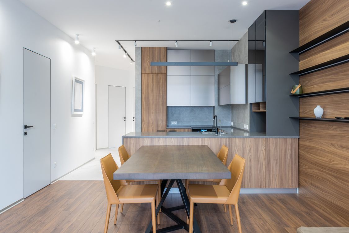 Compact kitchen with dining table Table near a kitchen counter in a compact home