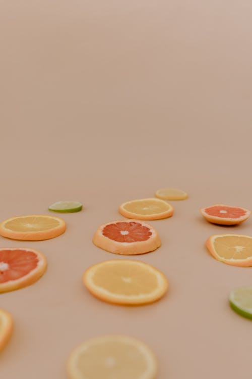 Sliced Citrus Fruits on a Surface