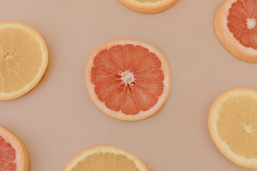 Sliced Orange Fruit on White Surface