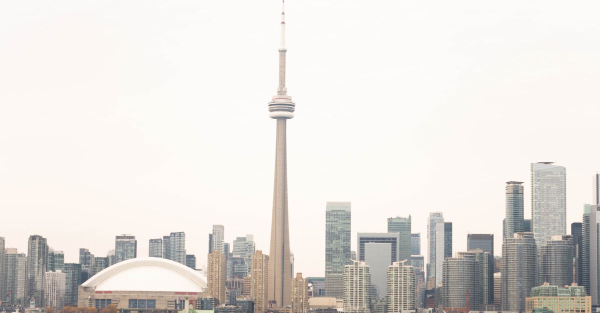 New pre-construction condo tower in downtown Toronto against the skyline