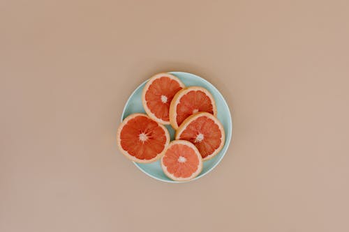 Gratis arkivbilde med fersk frukt, flat overflate, grapefrukt