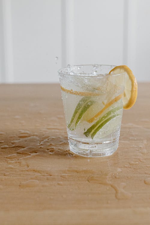 Free Clear Drinking Glass of Water With Lemon and Lime Slices Stock Photo
