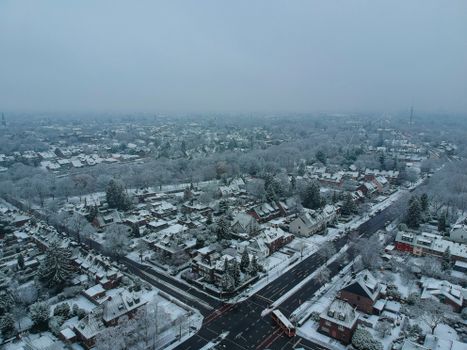 Discover the tranquil beauty of a snow-covered town in NRW, Germany, captured from above.