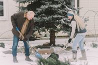 Man and Woman Holding Shovels