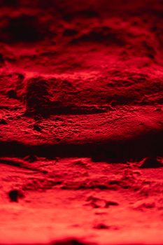 Vivid red abstract texture with rough surface, perfect for creative backgrounds.