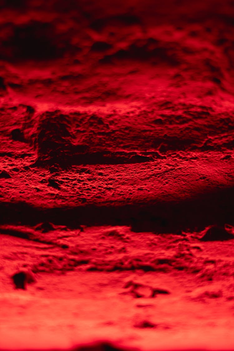 Red Rough Surface In Close Up Photography