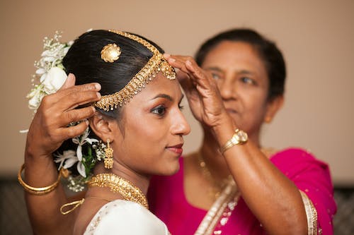 Free Sinhalese woman helping daughter before traditional wedding ceremony Stock Photo