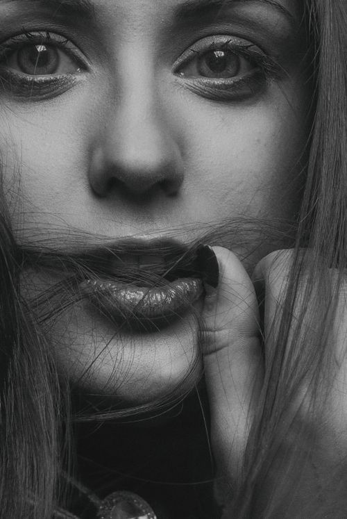 Free Artistic monochrome close-up of a woman's face, capturing emotion and detail. Stock Photo