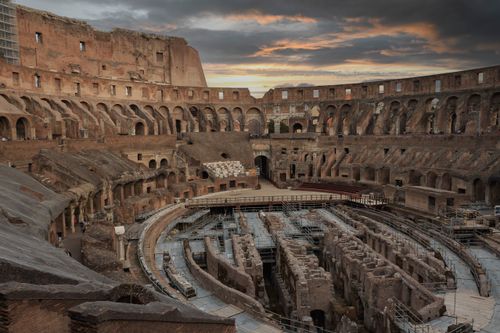 Free Captivating view of the Colosseum's ancient architecture during sunset in Rome, Italy. Stock Photo