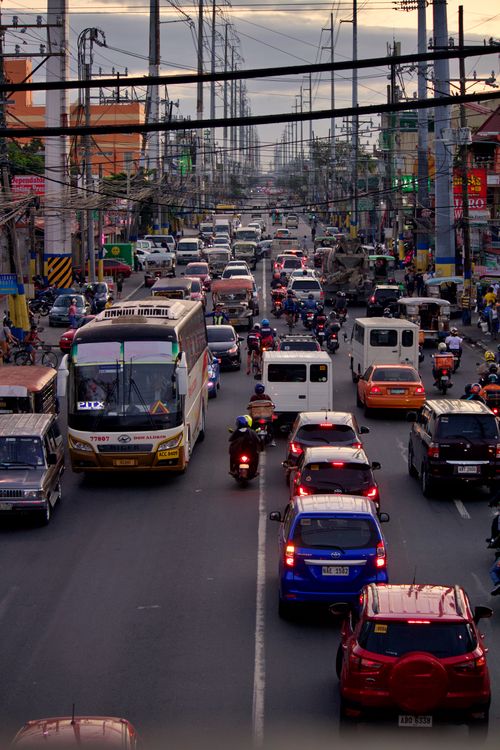 Free Heavy traffic scene in Bacoor, Philippines during rush hour with diverse vehicles. Stock Photo