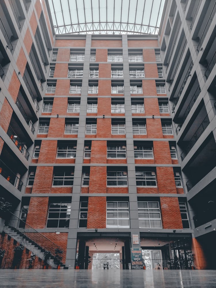 Atrium Of A Brown And White Concrete Building