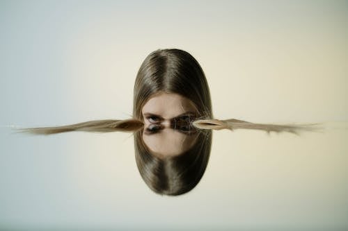A Person near a Mirror Reflection