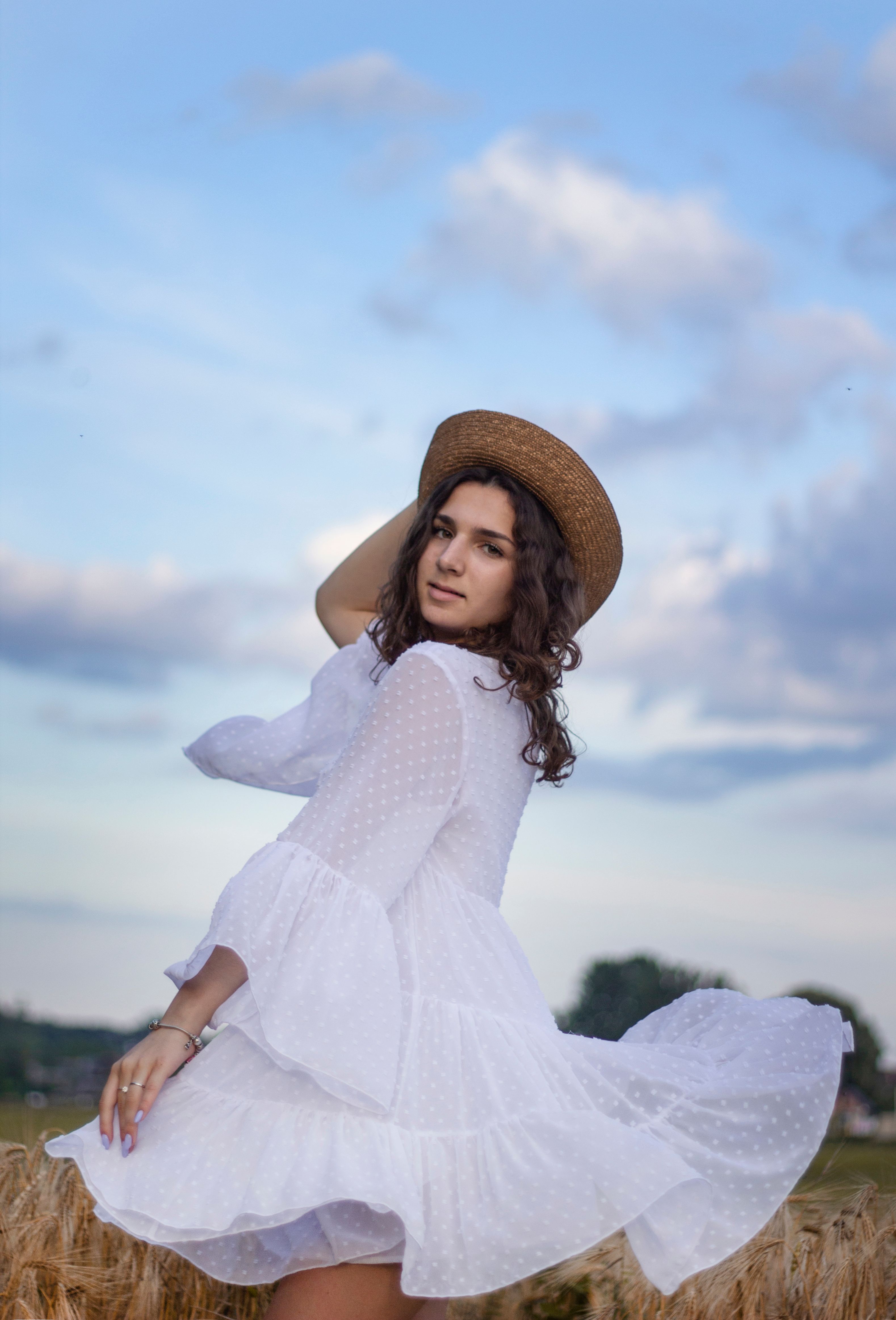 Woman in white Dress Posing on Grass Field · Free Stock Photo