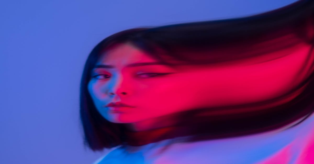 A Distorted Photo of a Short Haired Woman in White Shirt · Free Stock Photo