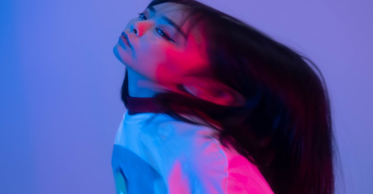 A Distorted Photo of a Short Haired Woman in White Shirt · Free Stock Photo