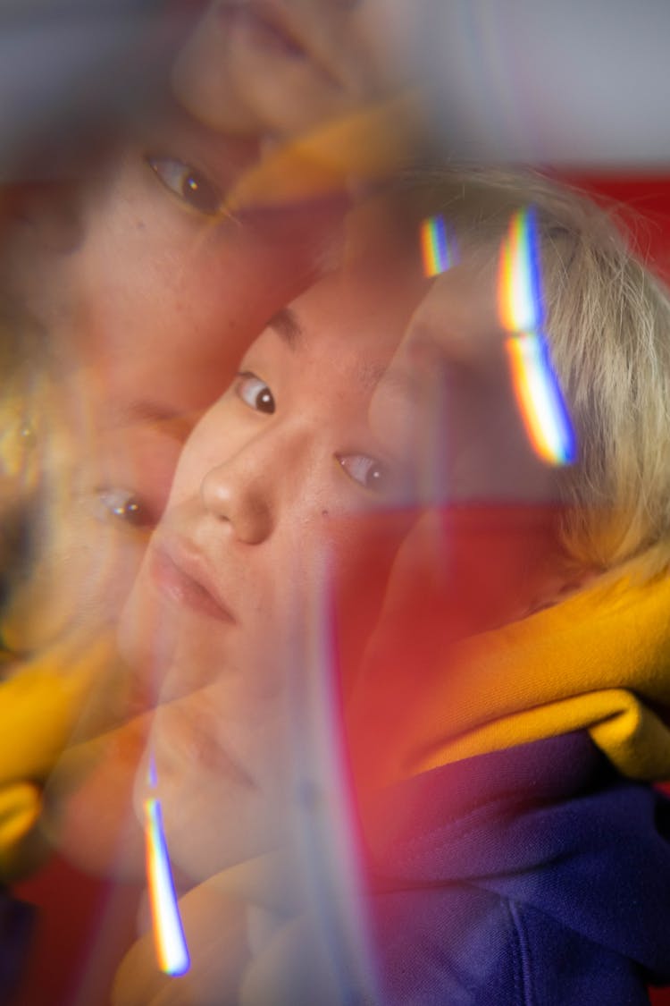 A Multiple Exposure  Photo Of A Man In White And Blue Jacket