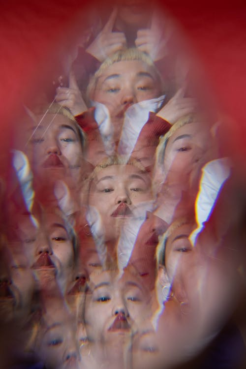 A Multiple Exposure Photo of a Person Sticking Tongue Out