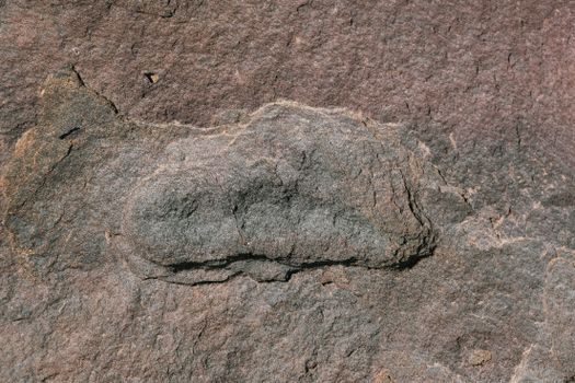 High-resolution texture of a natural rock surface showcasing its rough details.