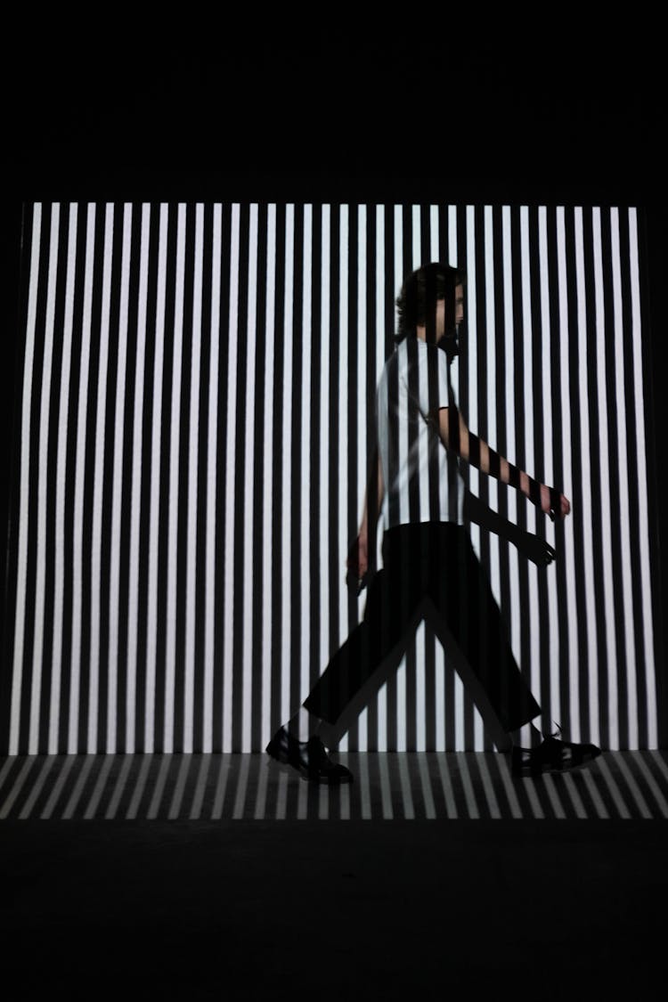 Man Walking On Stripe Wall