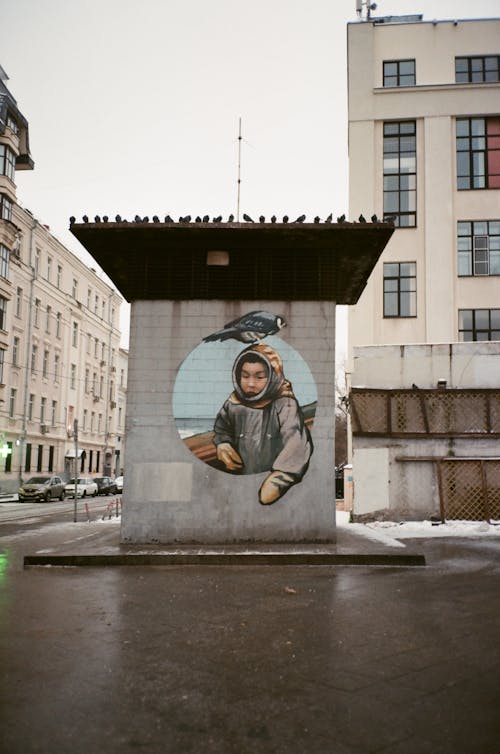 Chukchi man drawn on concrete construction located on residential city district on cloudy winter day