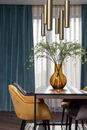 Vase with flowers on table