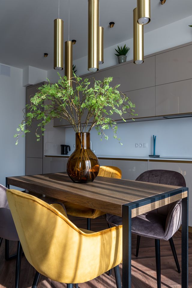 Dining room with a wooden table and velour chairs — photo by Max Vakhtbovych on Pexels
