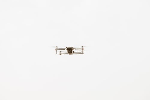 Free White and Black Drone in Mid Air Stock Photo