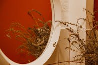 White Round Framed Mirror on White Wall Tiles