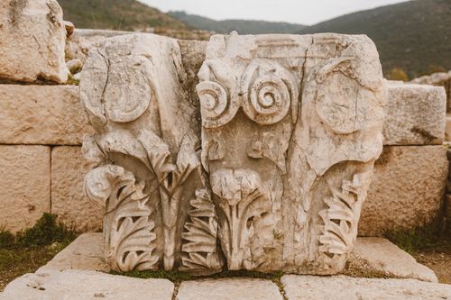 Free Close-up of an intricately carved ancient stone in outdoor historical ruins. Stock Photo