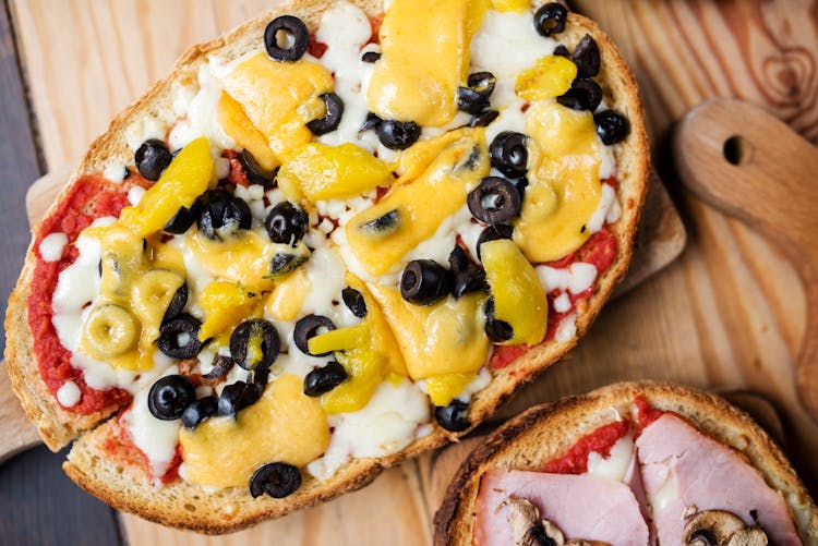 Tasty Toasts With Black Olive Rings And Cheese