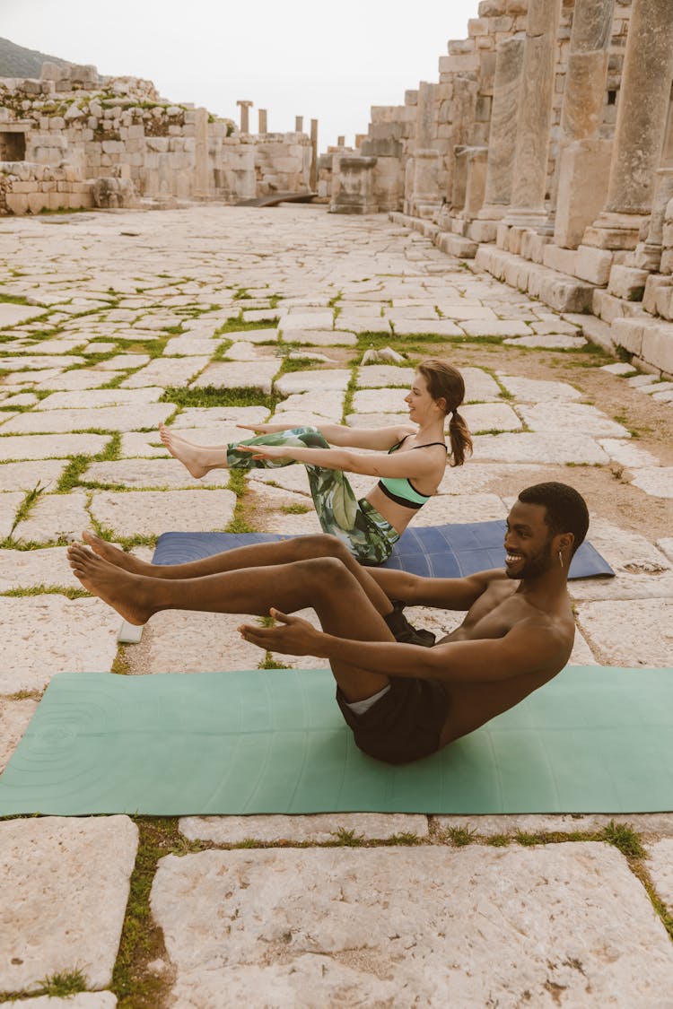 People Exercising On Yoga Mats