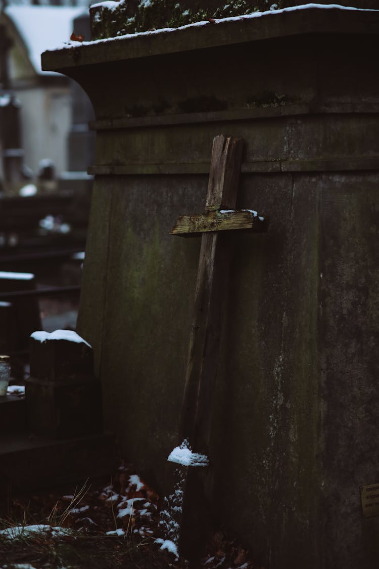 Wooden Cross On A Tombstone 