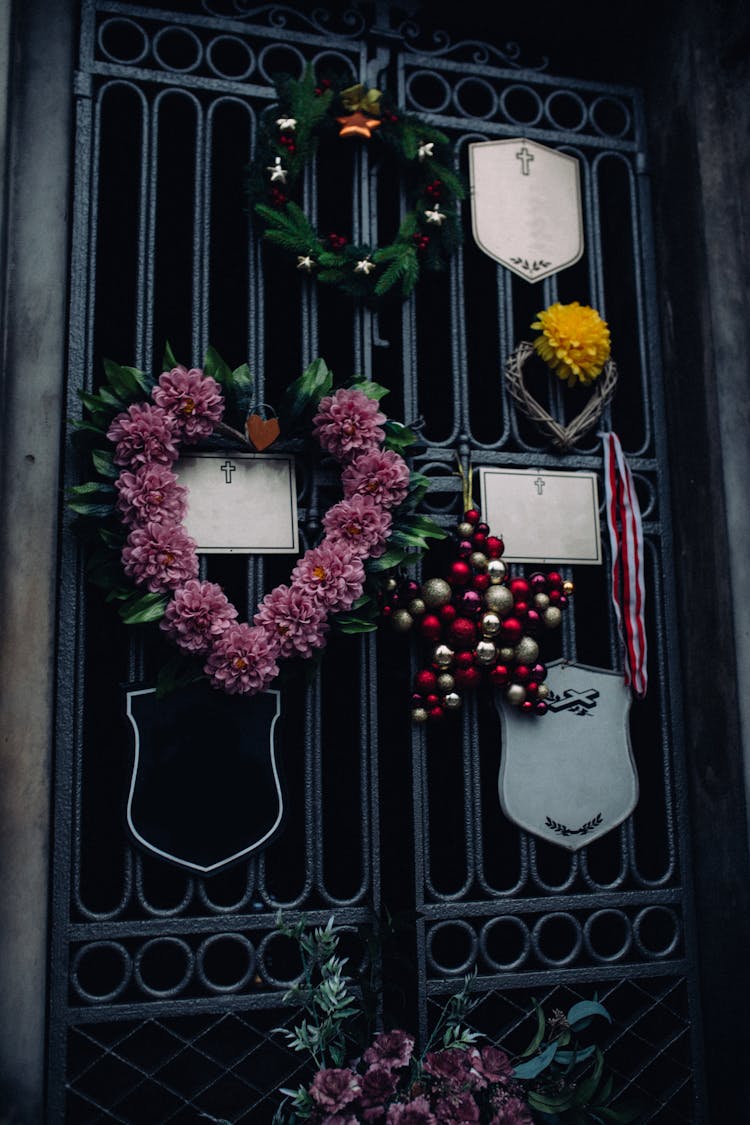 Garlands Hanging On A Black Gate