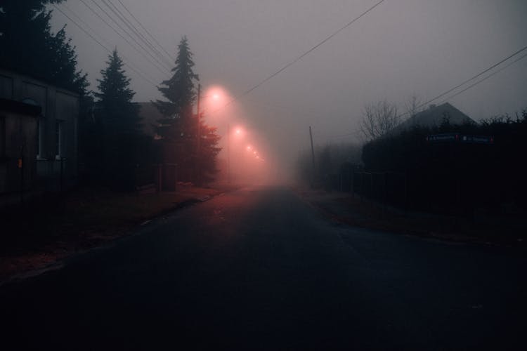 Gray Asphalt Road With Fog During Night Time