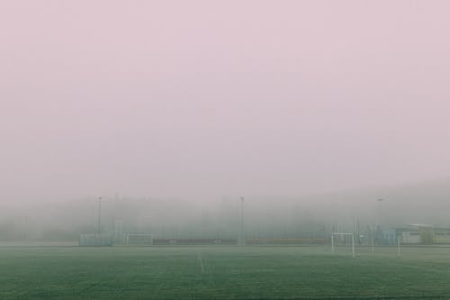 A Football Field Covered in Thick Fog