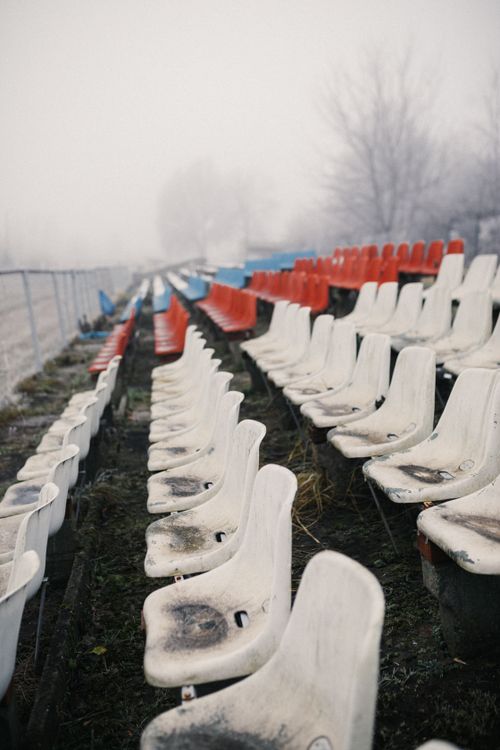 Free Desolate, foggy stadium with empty seats, creating an eerie atmosphere. Stock Photo