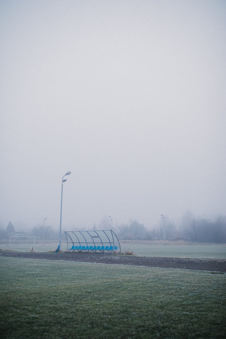 Empty Seats In The Football Field Team Bench