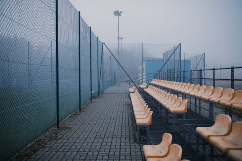 Free Empty Bleacher Seats in a Football Stadium Stock Photo